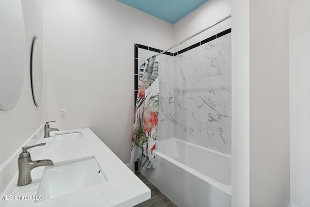 601 E Beach Blvd, Long Beach, MS 39560 - bathroom with shower / bath combo with shower curtain, double vanity, and wood finished floors