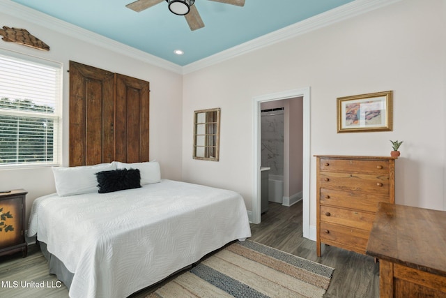 bedroom featuring ensuite bathroom, ceiling fan, dark hardwood / wood-style floors, and crown molding