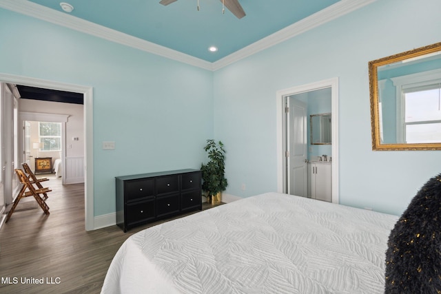 bedroom with connected bathroom, ceiling fan, dark hardwood / wood-style floors, and crown molding