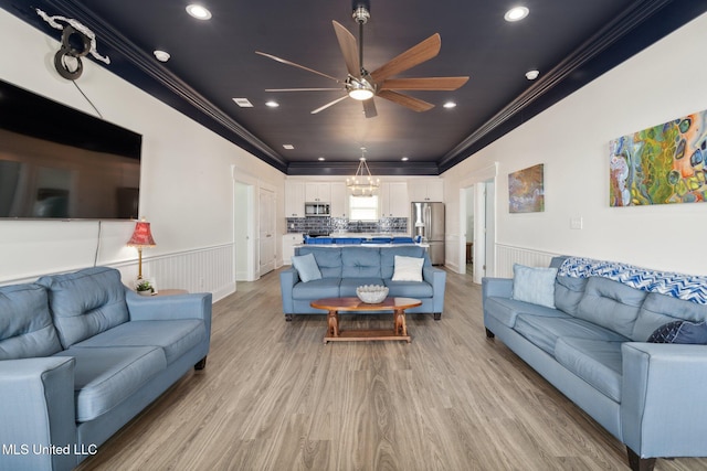 601 E Beach Blvd, Long Beach, MS 39560 - living room featuring ornamental molding, a ceiling fan, a wainscoted wall, light wood finished floors, and recessed lighting