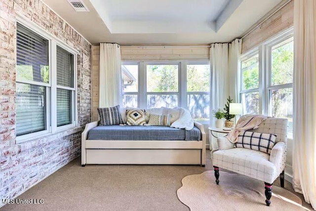 sunroom with a raised ceiling