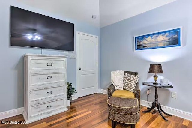 living area with hardwood / wood-style floors