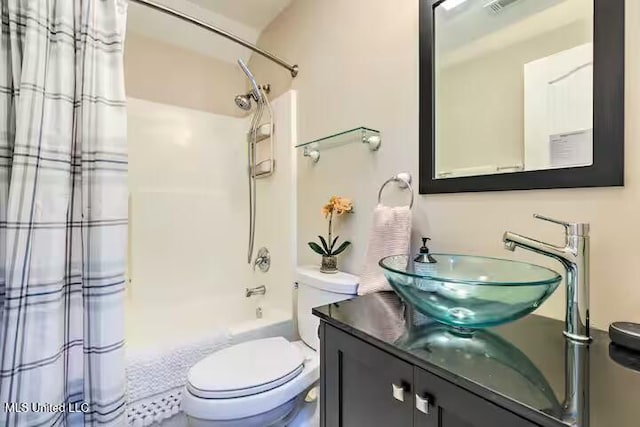 full bathroom with shower / bath combination with curtain, vanity, and toilet