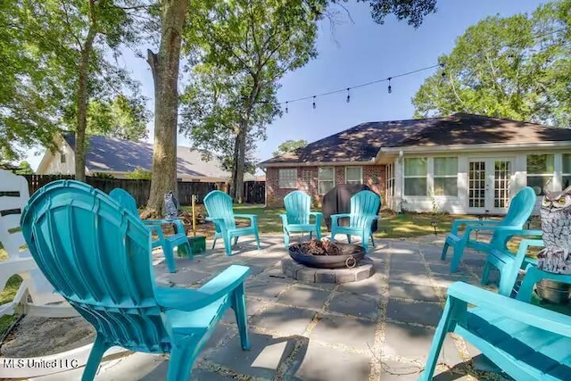 view of patio / terrace featuring french doors and an outdoor fire pit