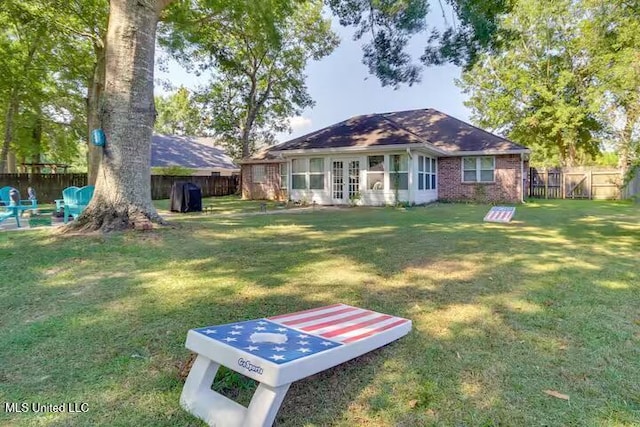 view of yard featuring french doors