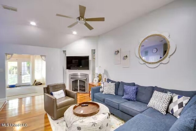 living room featuring french doors, ceiling fan, lofted ceiling, and hardwood / wood-style floors