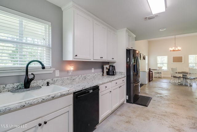 51 Decalb Oneal Rd, Perkinston, MS 39573 - kitchen featuring black dishwasher, a sink, refrigerator with ice dispenser, concrete floors, and a chandelier