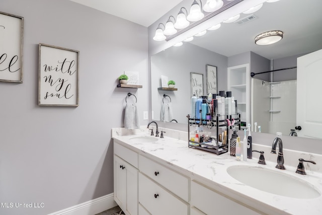 51 Decalb Oneal Rd, Perkinston, MS 39573 - bathroom featuring double vanity and a shower