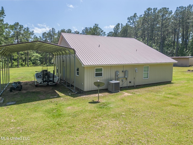 51 Decalb Oneal Rd, Perkinston, MS 39573 - back of property featuring central AC, a yard, driveway, and metal roof