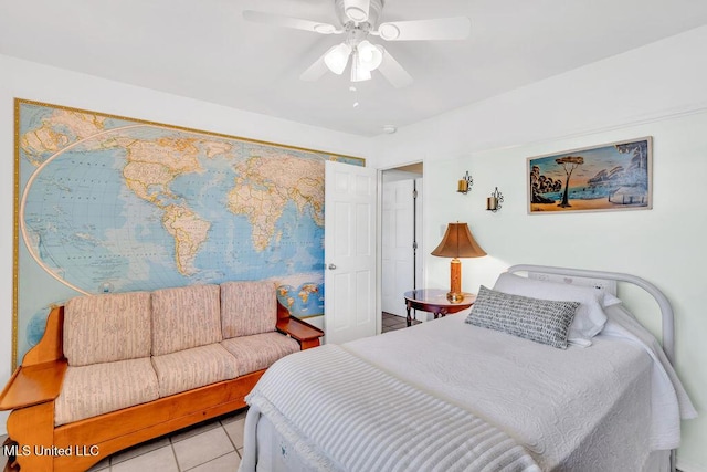 bedroom with light tile patterned floors and a ceiling fan