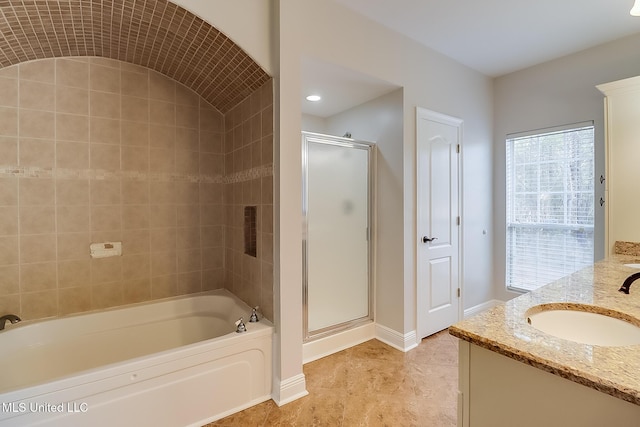 bathroom featuring tile patterned floors, vanity, and plus walk in shower