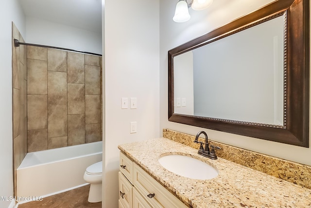 full bathroom with vanity, toilet, and tiled shower / bath combo