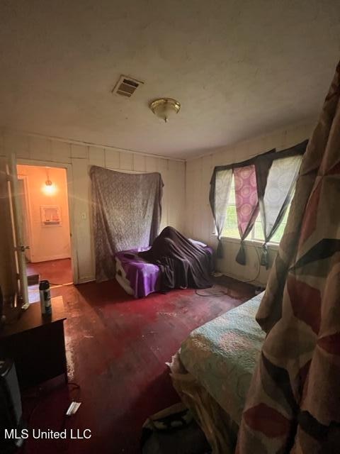 carpeted bedroom featuring ensuite bath