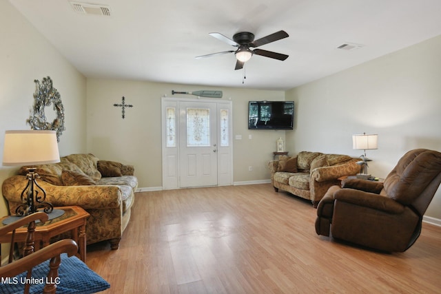 10167 Lagan St, Bay Saint Louis, MS 39520 - living area with ceiling fan, light wood-type flooring, and baseboards