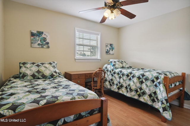 bedroom featuring hardwood / wood-style flooring and ceiling fan