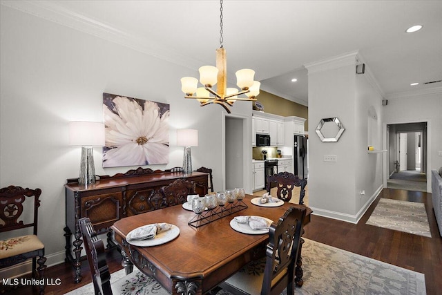 dining space featuring ornamental molding, dark hardwood / wood-style floors, and an inviting chandelier