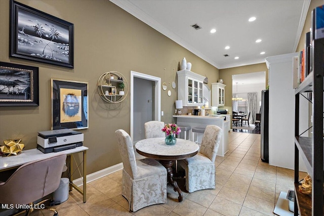 dining room with crown molding, light tile patterned flooring, and a chandelier