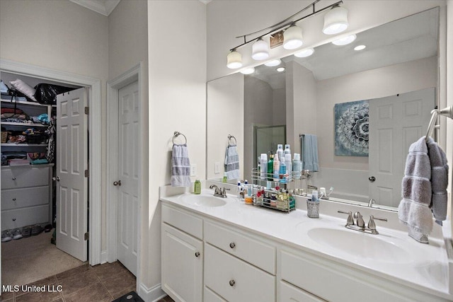 bathroom featuring walk in shower, tile patterned floors, and vanity