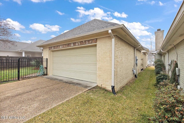 garage featuring a yard