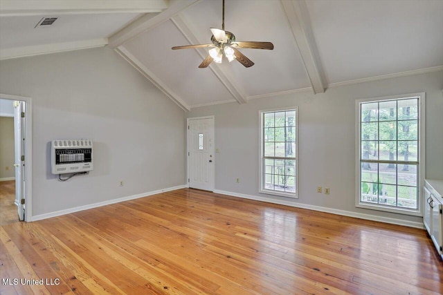 unfurnished living room featuring ceiling fan, baseboards, heating unit, vaulted ceiling with beams, and light wood-style flooring