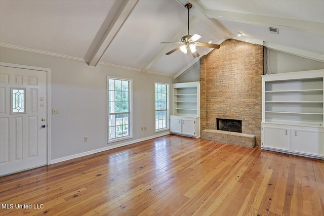 unfurnished living room featuring ceiling fan, visible vents, a fireplace, beamed ceiling, and light wood-style flooring