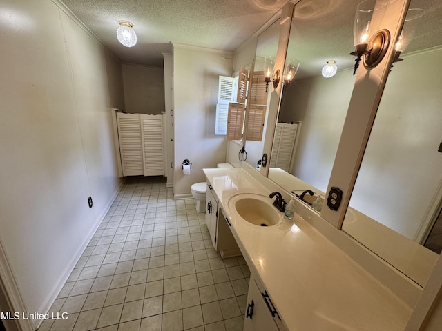 221 S Oak Ave, Ruleville, MS 38771 - bathroom featuring tile patterned floors, vanity, a textured ceiling, and ornamental molding