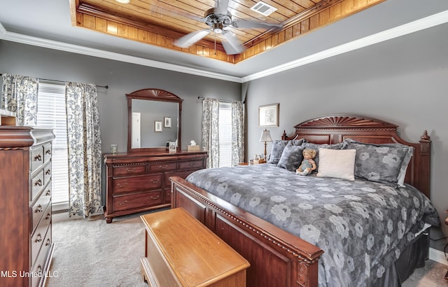 bedroom with visible vents, a tray ceiling, ornamental molding, wooden ceiling, and light colored carpet