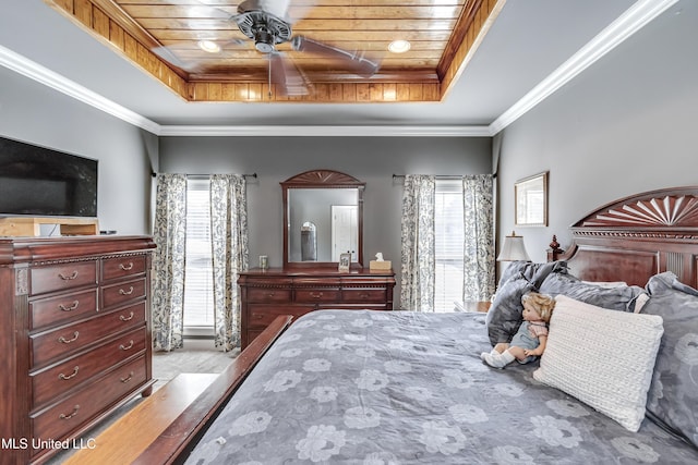 bedroom featuring a tray ceiling, wood ceiling, and crown molding