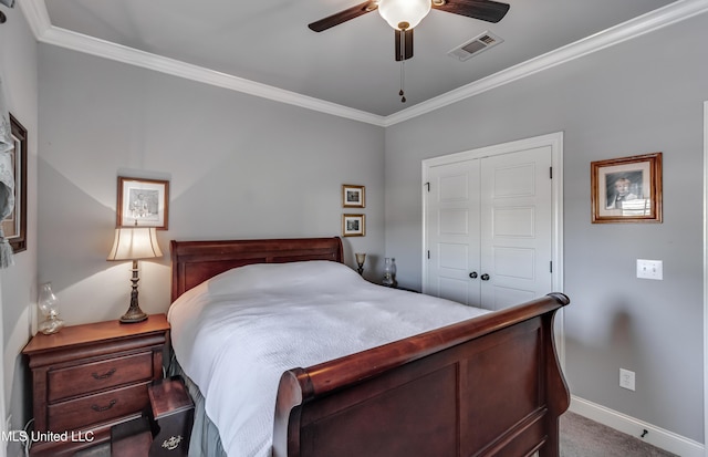 bedroom with baseboards, visible vents, a closet, and ornamental molding