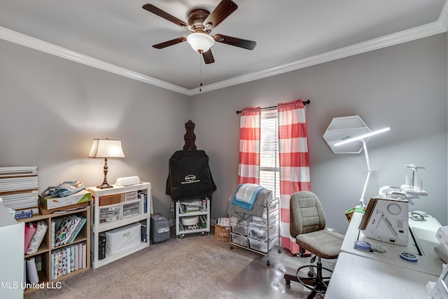 office space with carpet flooring, ornamental molding, and a ceiling fan