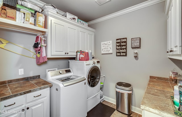 clothes washing area featuring visible vents, baseboards, cabinet space, crown molding, and independent washer and dryer