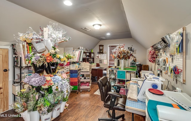 home office with visible vents, wood finished floors, and vaulted ceiling