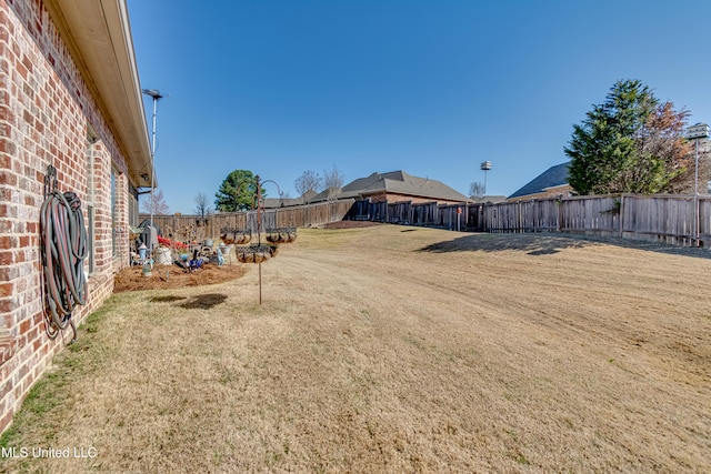 view of yard with a fenced backyard