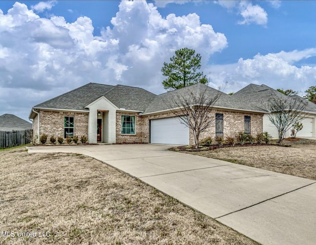 view of front of house with brick siding, a shingled roof, an attached garage, and driveway