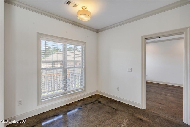 empty room featuring visible vents, baseboards, crown molding, and dark carpet