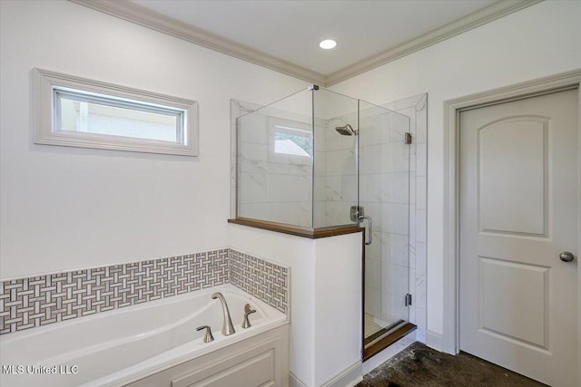 full bath featuring a garden tub, crown molding, and a shower stall