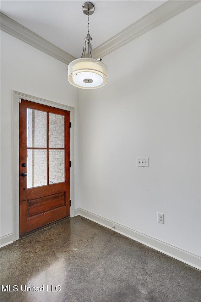interior space featuring crown molding and baseboards
