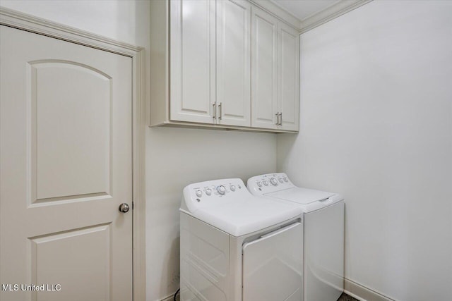 laundry room featuring cabinet space and separate washer and dryer