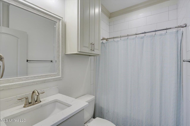 bathroom featuring vanity, toilet, and a shower with shower curtain