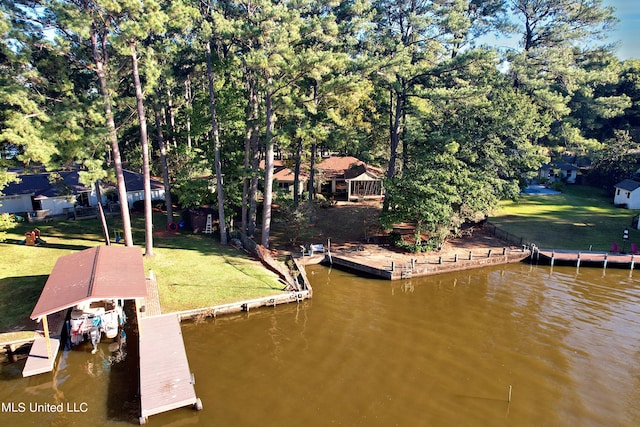 dock area with a water view and a lawn