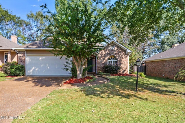 view of front of home featuring a front yard and a garage