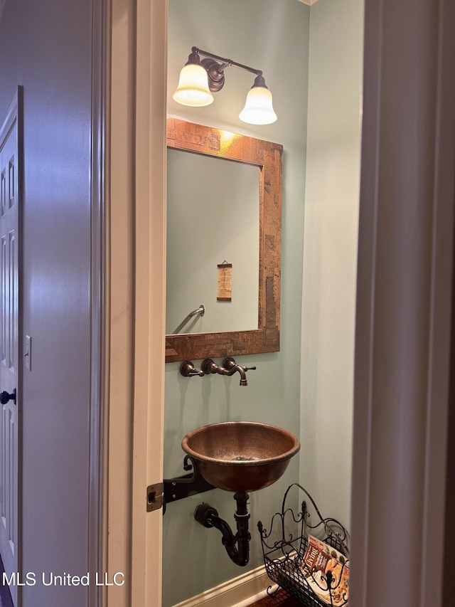 856 Wellington Way, Madison, MS 39110 - bathroom featuring a sink and baseboards