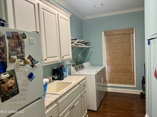 856 Wellington Way, Madison, MS 39110 - laundry room with cabinet space, independent washer and dryer, dark wood-style floors, ornamental molding, and baseboards