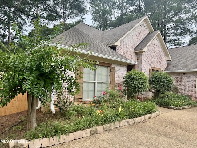 856 Wellington Way, Madison, MS 39110 - view of front of home featuring brick siding, a shingled roof, and an attached garage