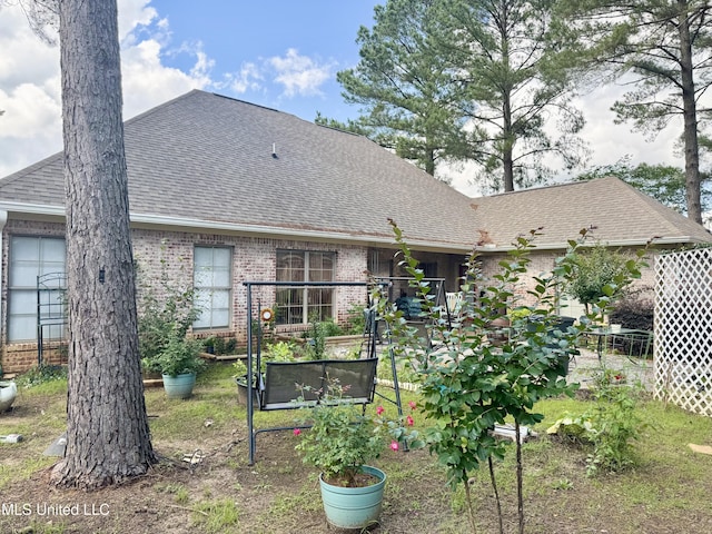 856 Wellington Way, Madison, MS 39110 - rear view of property featuring roof with shingles and brick siding