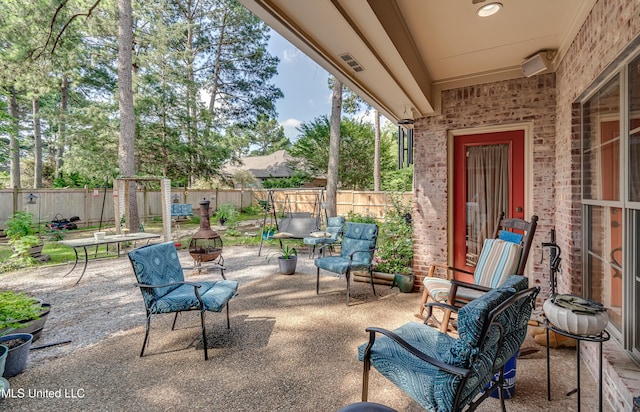 856 Wellington Way, Madison, MS 39110 - fenced backyard featuring a patio area and a fire pit