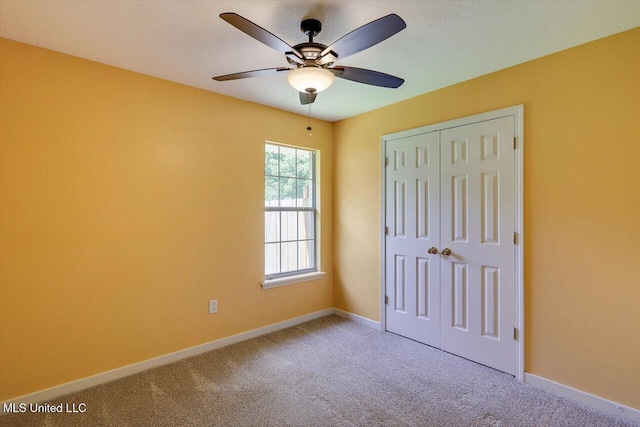 4328 Blaine Cir, Byram, MS 39272 - unfurnished bedroom with carpet, a closet, and a ceiling fan