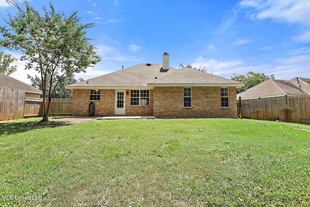 4328 Blaine Cir, Byram, MS 39272 - rear view of property with a chimney, a fenced backyard, and brick siding