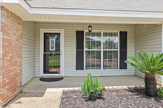 4328 Blaine Cir, Byram, MS 39272 - property entrance with covered porch and a shingled roof