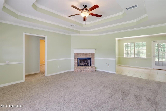 4328 Blaine Cir, Byram, MS 39272 - unfurnished living room with a raised ceiling, carpet floors, a ceiling fan, ornamental molding, and a brick fireplace